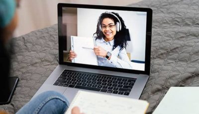 high-angle-teenage-girl-using-laptop-online-school